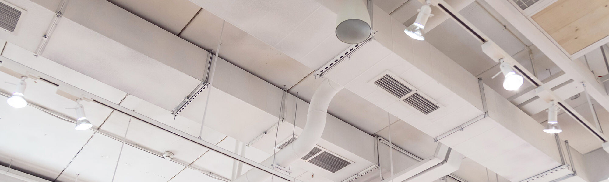 Ventilation ducts system painted in white composition of fire protection under the ceiling Ventilation ducts system painted in white composition of fire protection under the ceiling